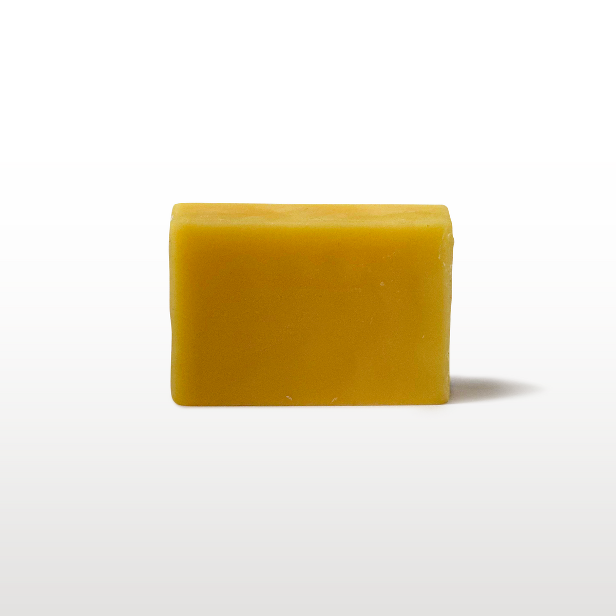 Snowboard wax accessory shown next to the board
